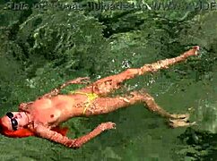 Wet Shaved Pussy Flashes from Yellow Trunks in Blue Beach Water!