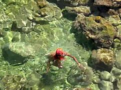 Wet Shaved Pussy Flashes from Yellow Trunks in Blue Beach Water!