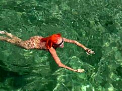 Wet Shaved Pussy Flashes from Yellow Trunks in Blue Beach Water!