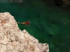 Wet Shaved Pussy Flashes from Yellow Trunks in Blue Beach Water!