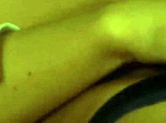 A lesbian mistress fingers herself to a powerful orgasm in bed.
