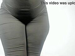big ass ebony mistress squeezes into tight jumpsuit showing off her hourglass curves and natural tits