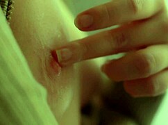 blonde model slowly reveals nipples and pussy up close