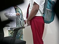 Woman Publicly Inspects Schoolboy's Dick in Hospital Exam