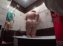behind the scenes a hidden camera spies on fat model in bathroom