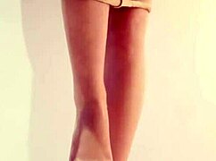 Young beauty shows off legs in white pantyhose