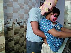 desi housewife shares a moment with her partner in the kitchen