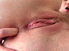 Blonde milf stretches her tight ass with three fingers and squirts hard