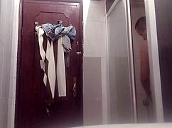naked man shaving his penis