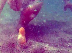 amateur couple getting adventurous and nude on public beach