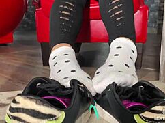 goddess plays with her feet in socks and barefoot under the table