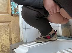 Mature milf pees in a hospital public toilet